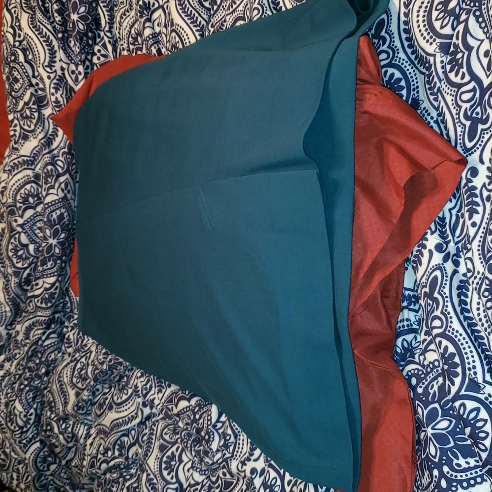 Vintage teal skirt with a small split in the front